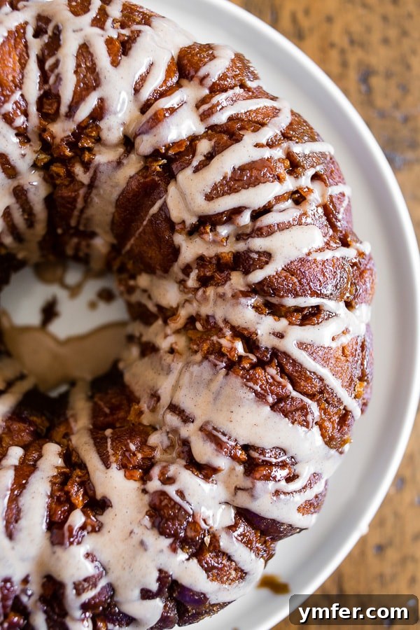 Cozy Autumn Apple Spice Monkey Bread 2 Pumpkin Spice Apple Monkey Bread on a white plate, ready to be served