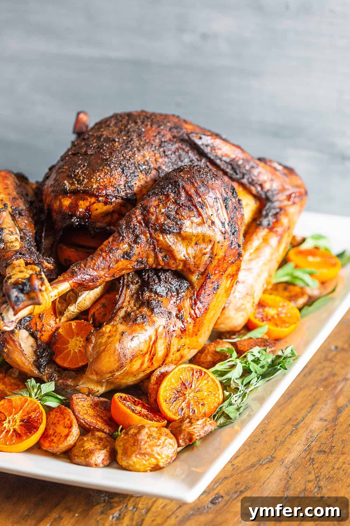 Classic Adobo Turkey 3 A cooked Adobo Butter Turkey served on a white platter.