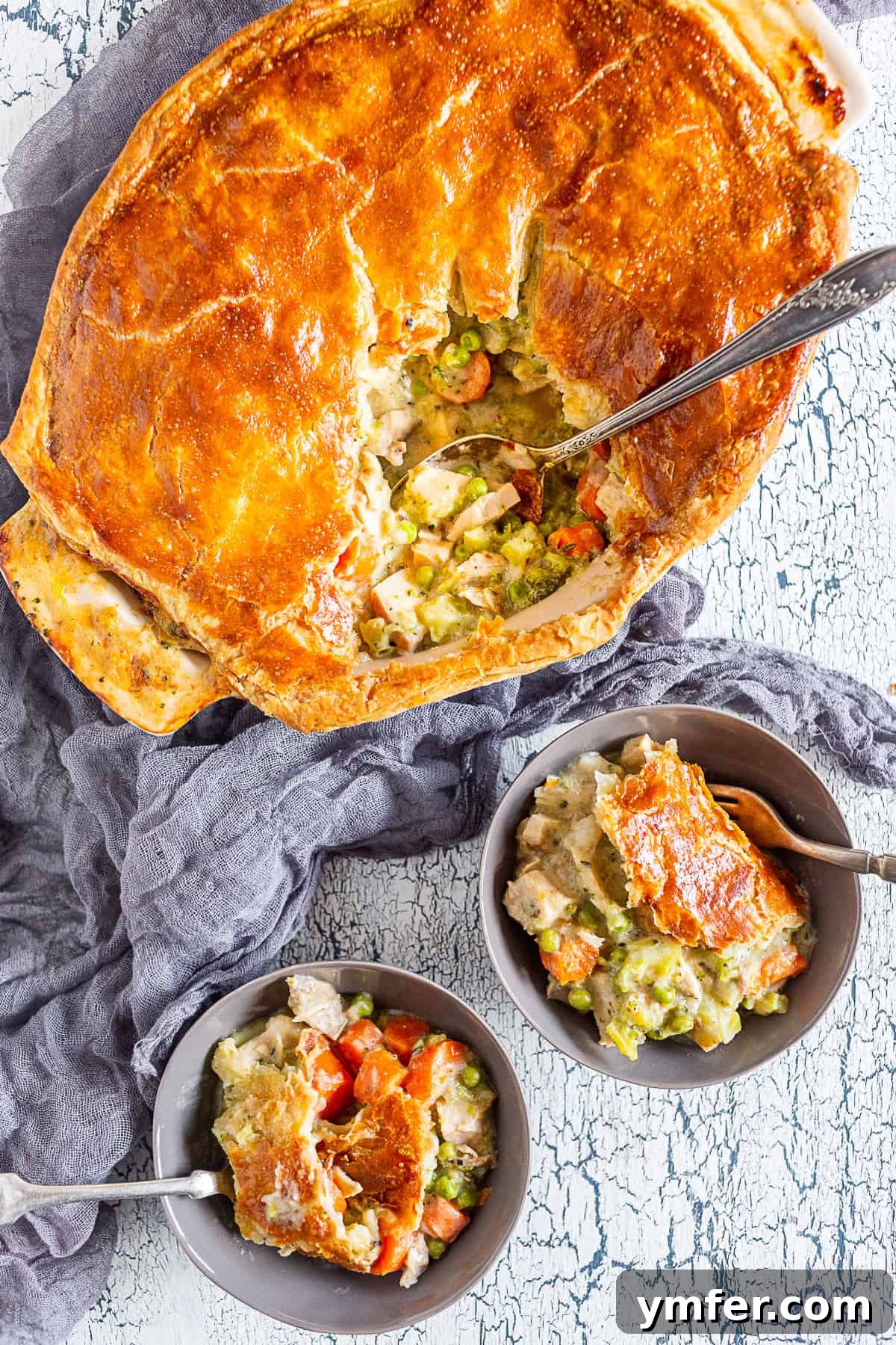 Golden Puff Pastry Turkey Pot Pie 2 Golden-brown puff pastry turkey pot pie in a casserole dish, fresh from the oven, ready to be served.