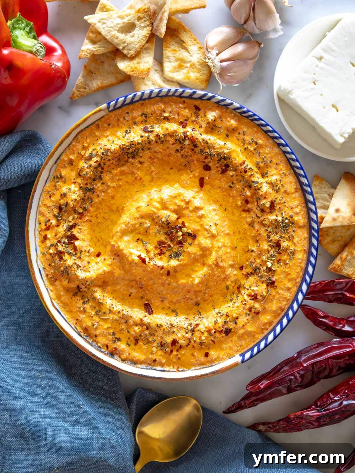 Fiery Feta Delight 2 Tirokafteri with feta and chili, served in a rustic bowl.