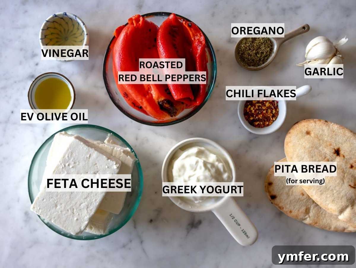 Fiery Feta Delight 4 Various ingredients for Tirokafteri artfully arranged on a marble table.