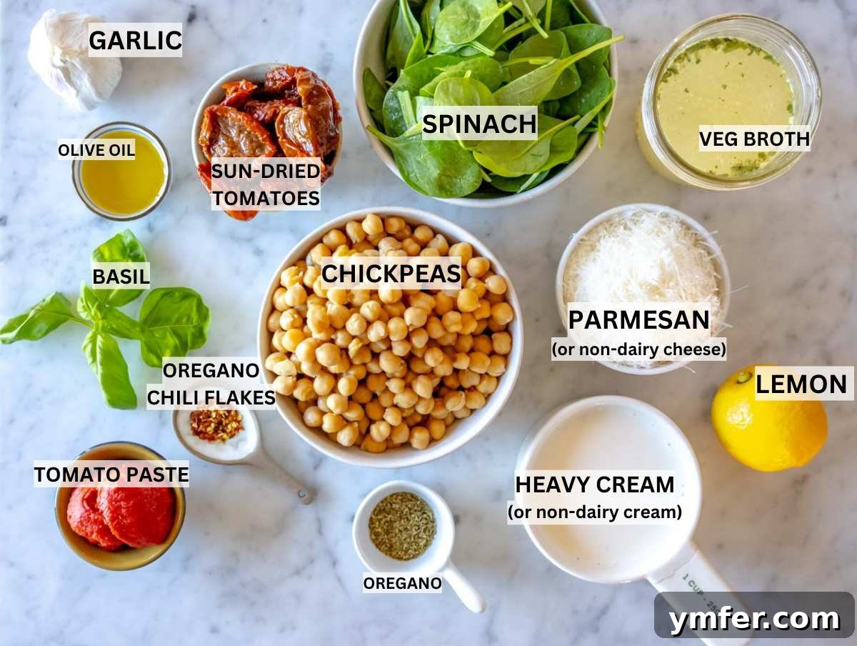 Soulmate Chickpeas 3 Array of fresh ingredients for marry me chickpeas laid out on a marble surface.