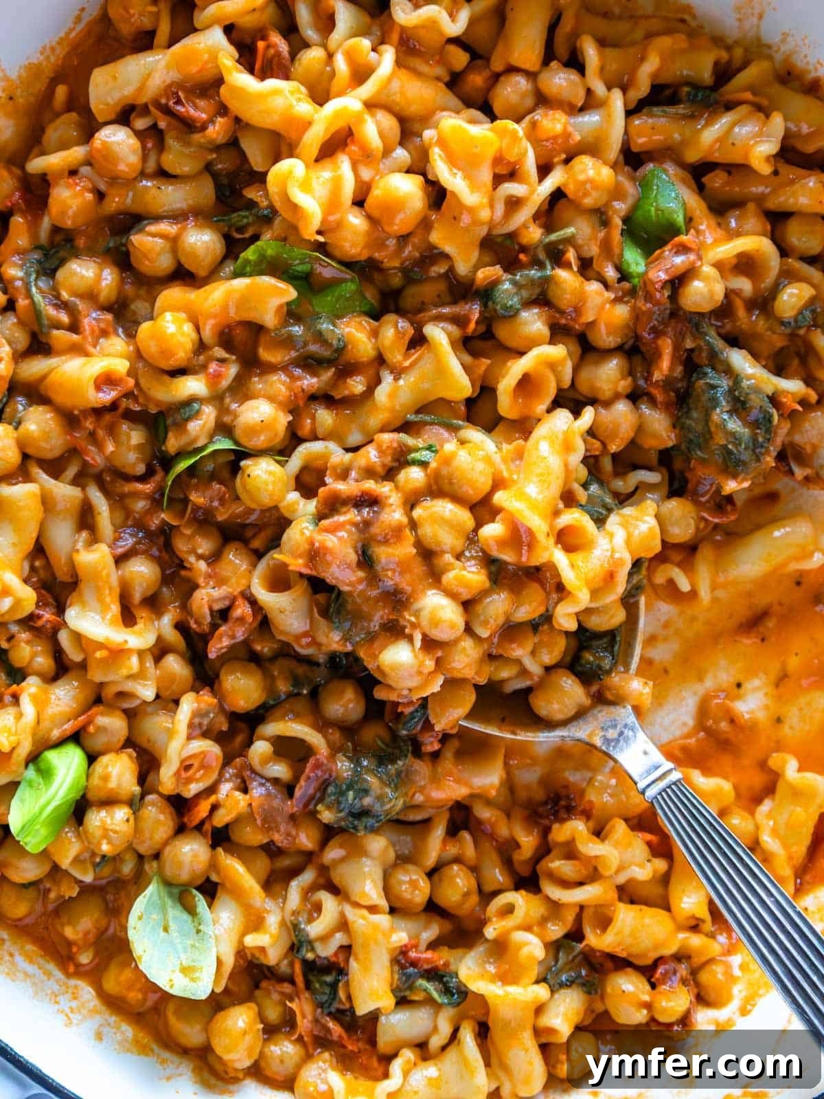 Soulmate Chickpeas 4 Marry me chickpeas beautifully plated with pasta, adorned with fresh basil.