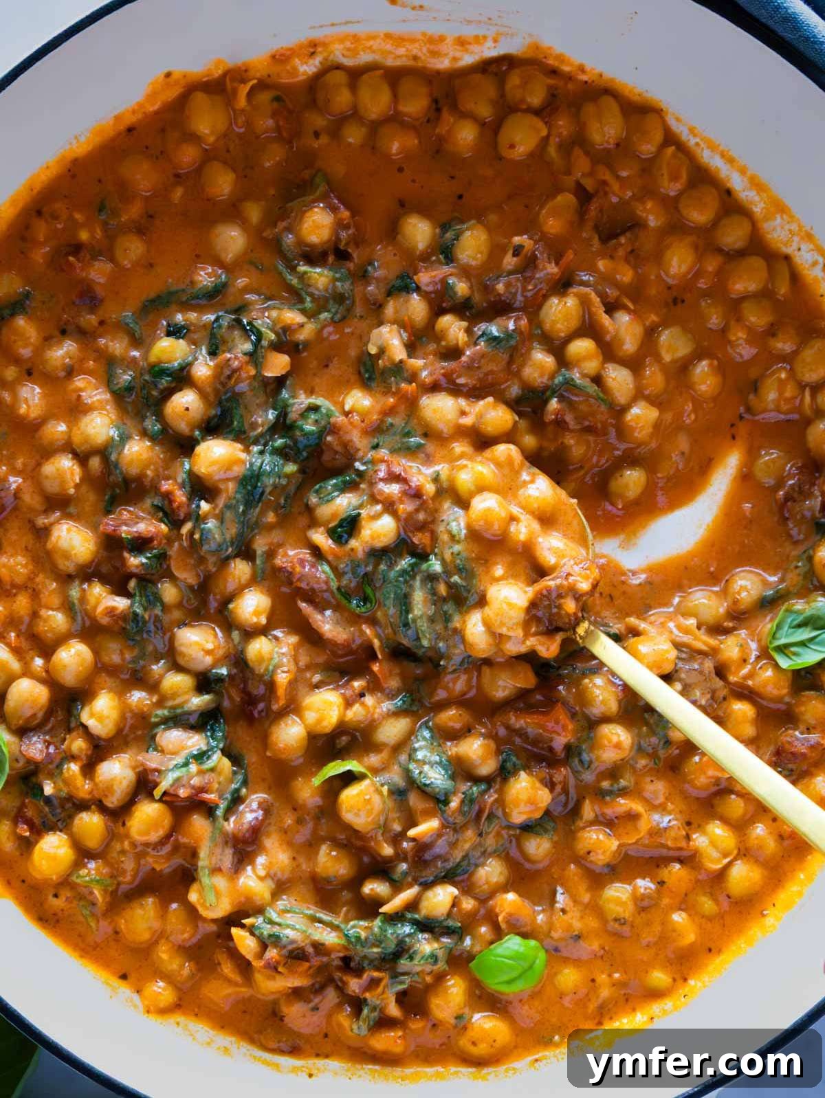 Soulmate Chickpeas 7 Marry me chickpeas, glistening in a cast iron skillet, ready to be served.