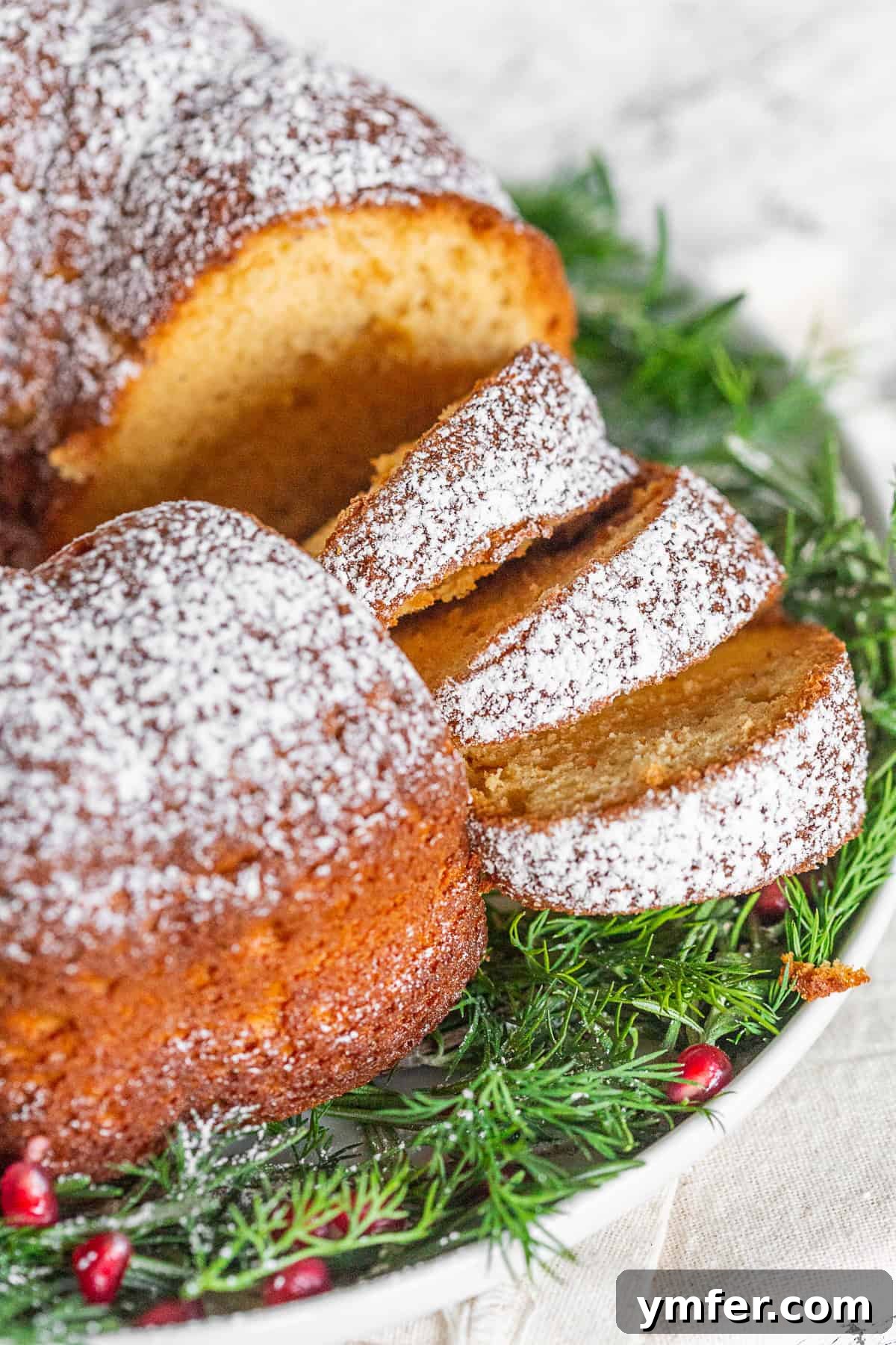 Elegant Sherry Bundt Cake 4 A large platter holds multiple slices of the festive cream sherry bundt cake, beautifully arranged for a holiday dessert spread.