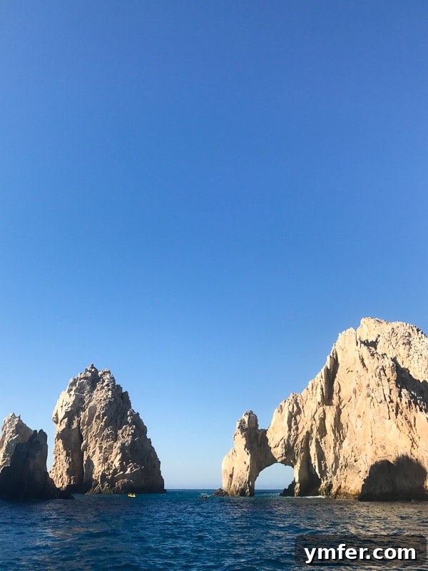 Cabo San Lucas: Mexico's Sun-Drenched Paradise 2 Princess Cruises ship docked in Cabo San Lucas, Mexico, with a luxury yacht in the foreground and clear blue waters.