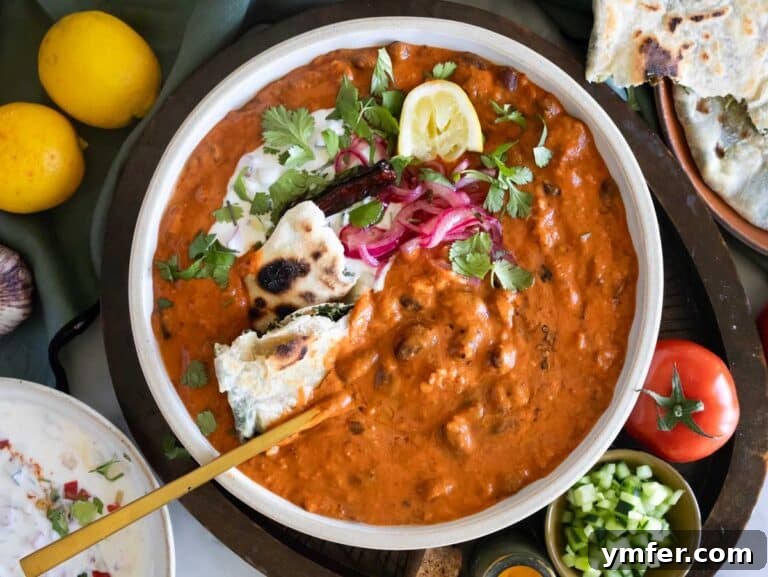 Refreshing Raita 9 Rajma recipe styled with cilantro, raita, and paratha.