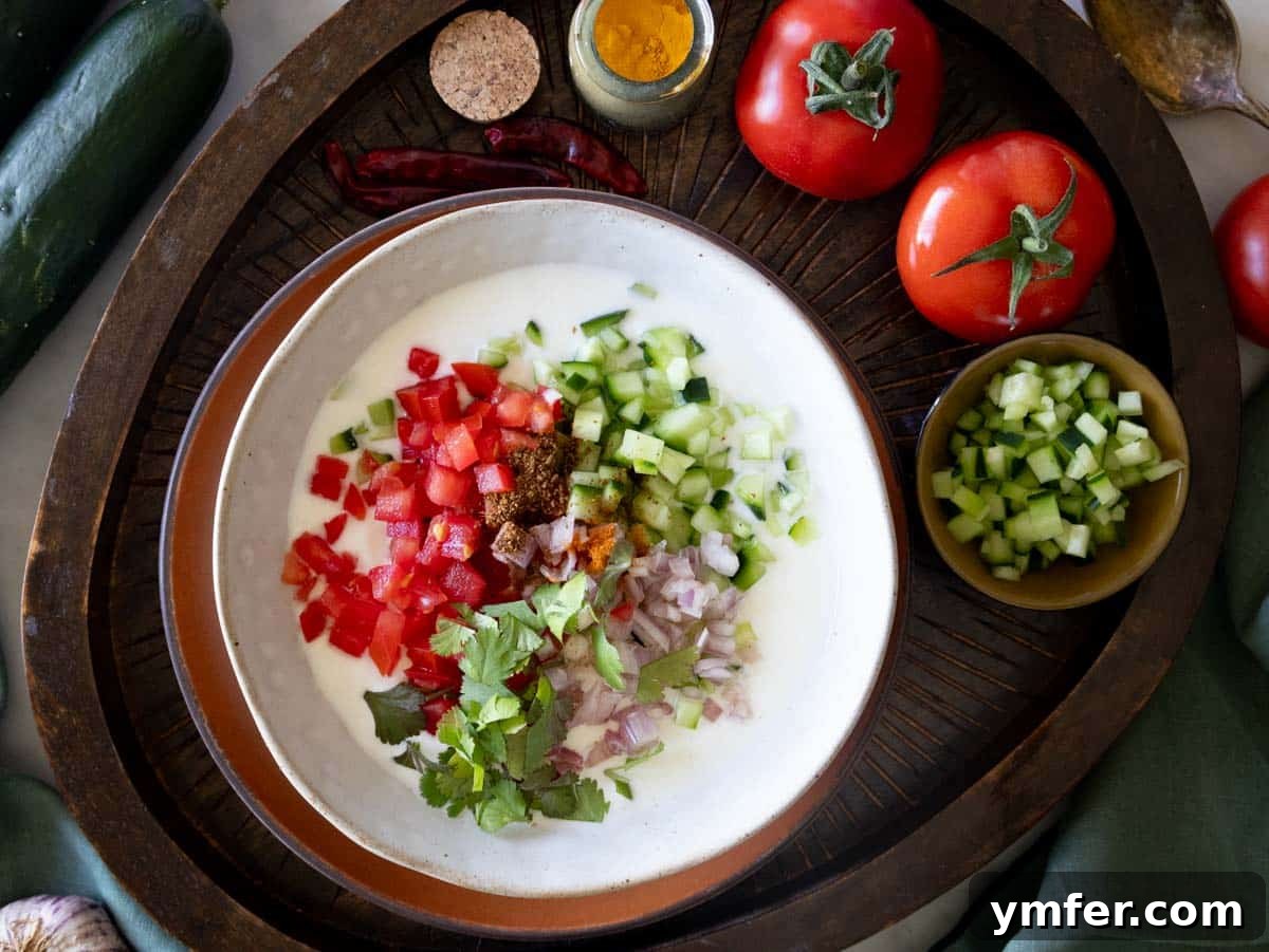 Refreshing Raita 3 Fresh Raita ingredients including yogurt, cucumber, tomatoes, and spices.