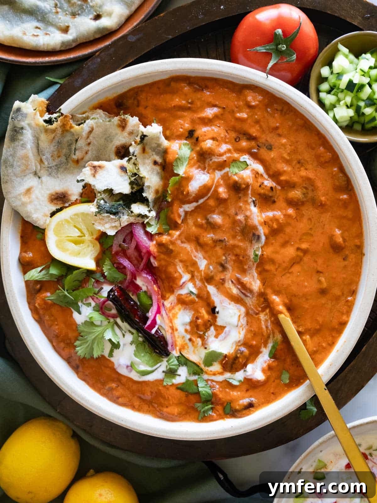 Refreshing Raita 5 Rajma topped with raita, pickled onions, and paratha.