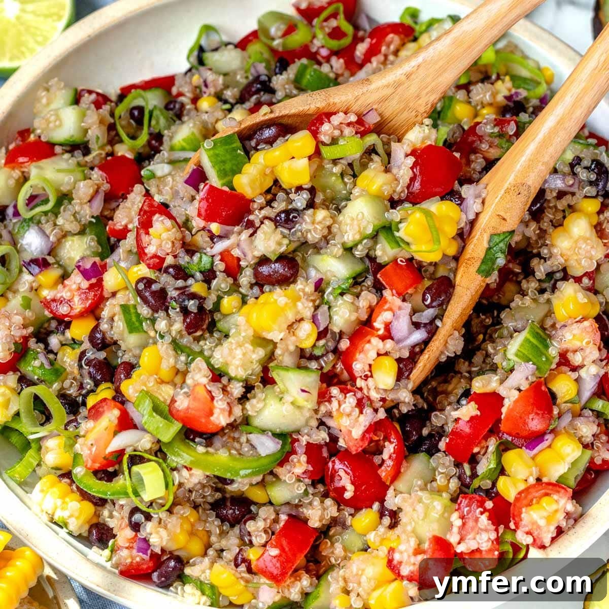 High Satisfaction Low-Calorie Meals 8 A vibrant quinoa salad recipe, showcasing black beans and fresh herbs.