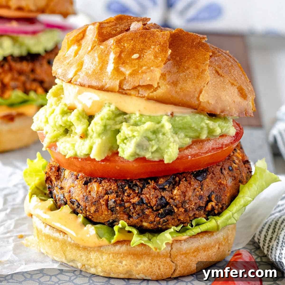 25 High Fiber Power Foods 16 Black bean burger with guacamole and tomato in a bun