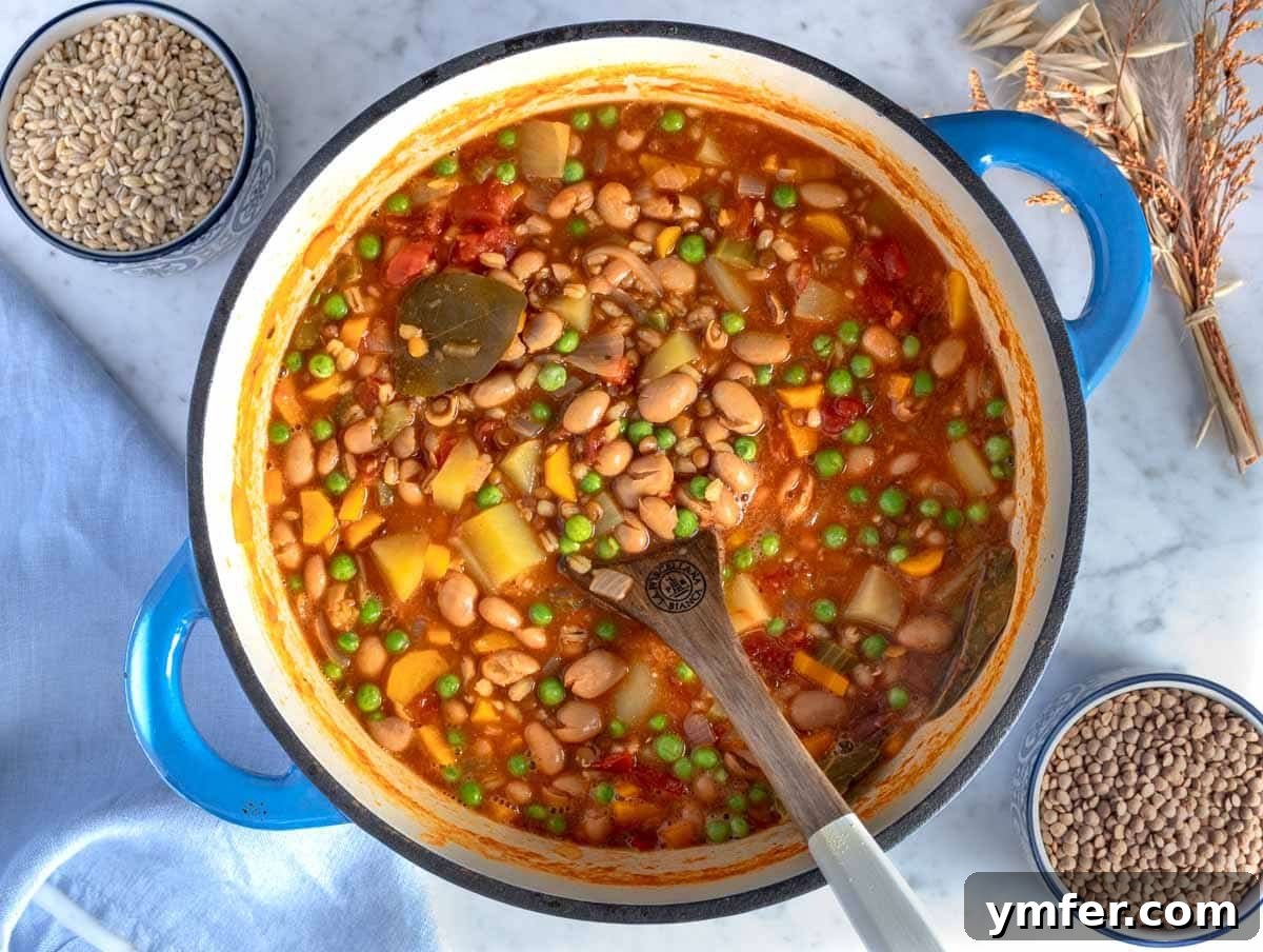 25 High Fiber Power Foods 3 Creamy barley soup in a blue pot.