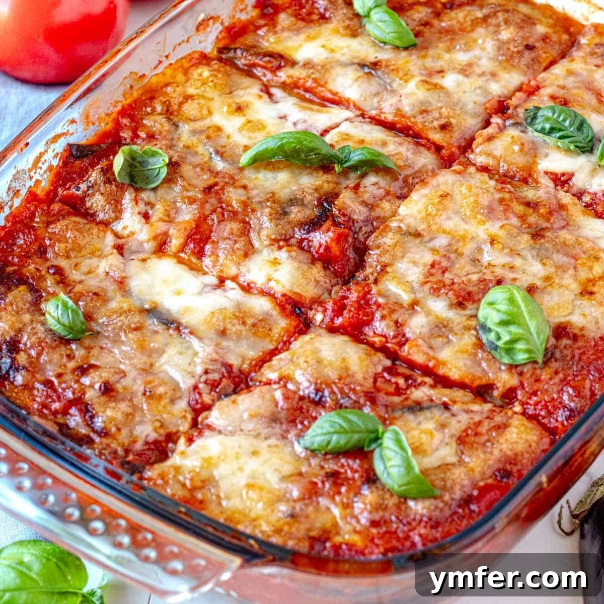 25 High Fiber Power Foods 25 Parmigiana with eggplant and fresh basil leaves