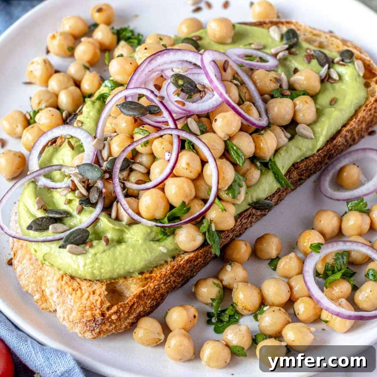 A perfectly prepared avocado toast, showcasing a creamy avocado spread on whole-grain bread.