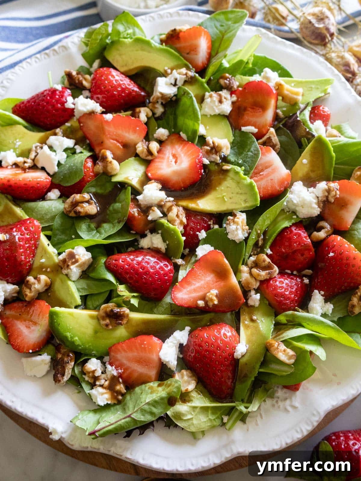 Vibrant Strawberry Spinach Salad 5 A large bowl of Strawberry Spinach Salad with feta and balsamic vinaigrette, ready to be served.