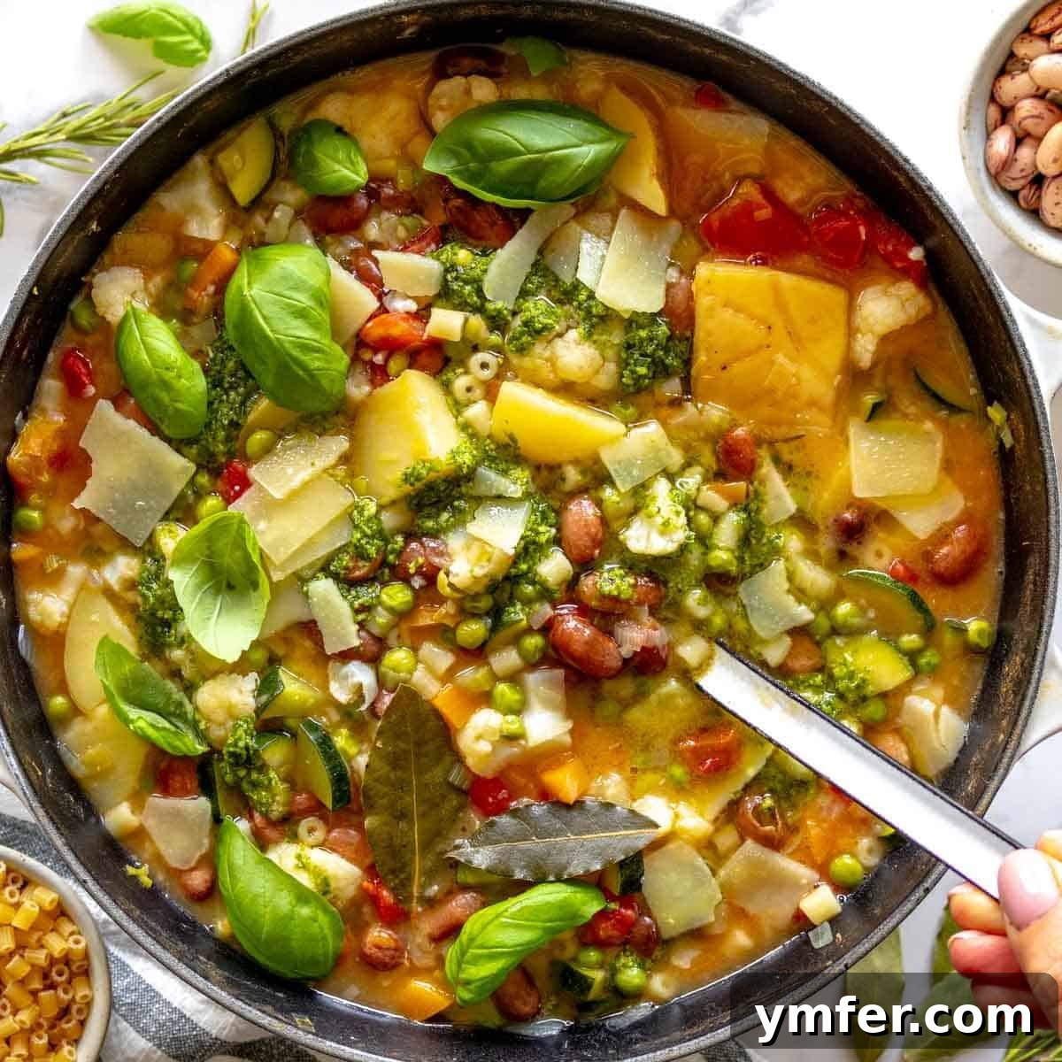 Heart-Smart Meals 20 Minestrone soup in a dutch oven with a white ladle. A comforting and healthy Italian soup.