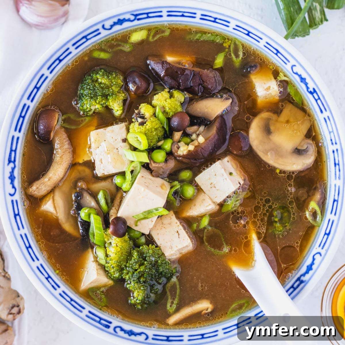 Heart-Smart Meals 24 Tofu soup with mushrooms, broccoli, and peas. A clear and healthy Asian-inspired soup.