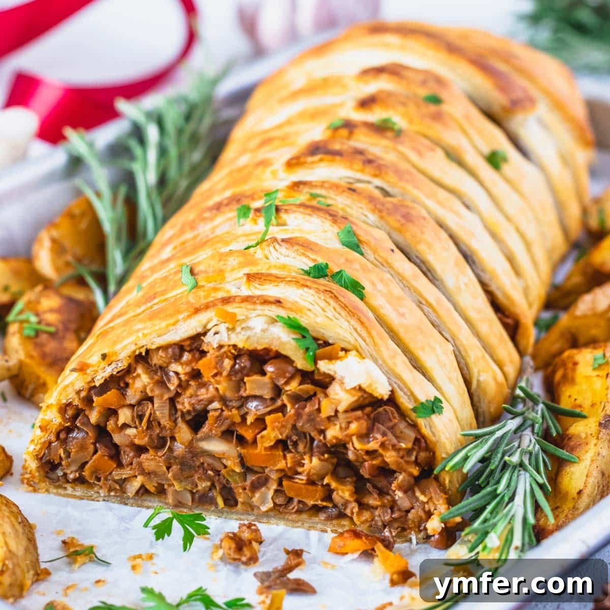 Heart-Smart Meals 28 Mushroom wellington with rosemary and roasted potatoes. A festive and savory vegan main course.