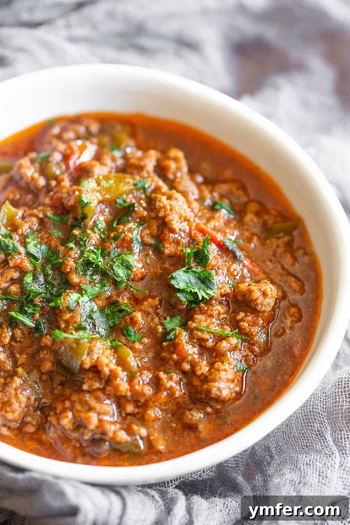 Sichuan Chili Pork Mince 3 A bowl of Ground Pork Chinese Chili served with fresh cilantro on top.