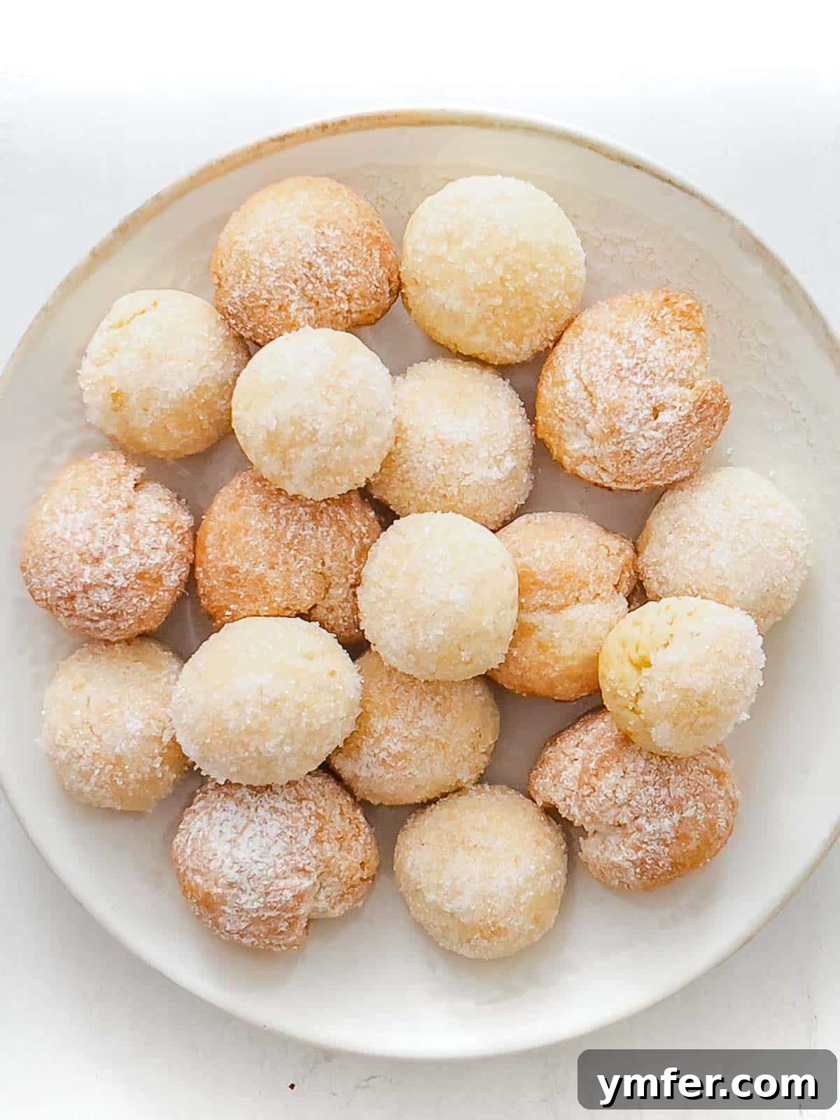 Castagnole Italian Carnival Fritters 2 Castagnole, traditional Italian sweet dough balls, showcasing both baked and deep-fried versions for Carnival