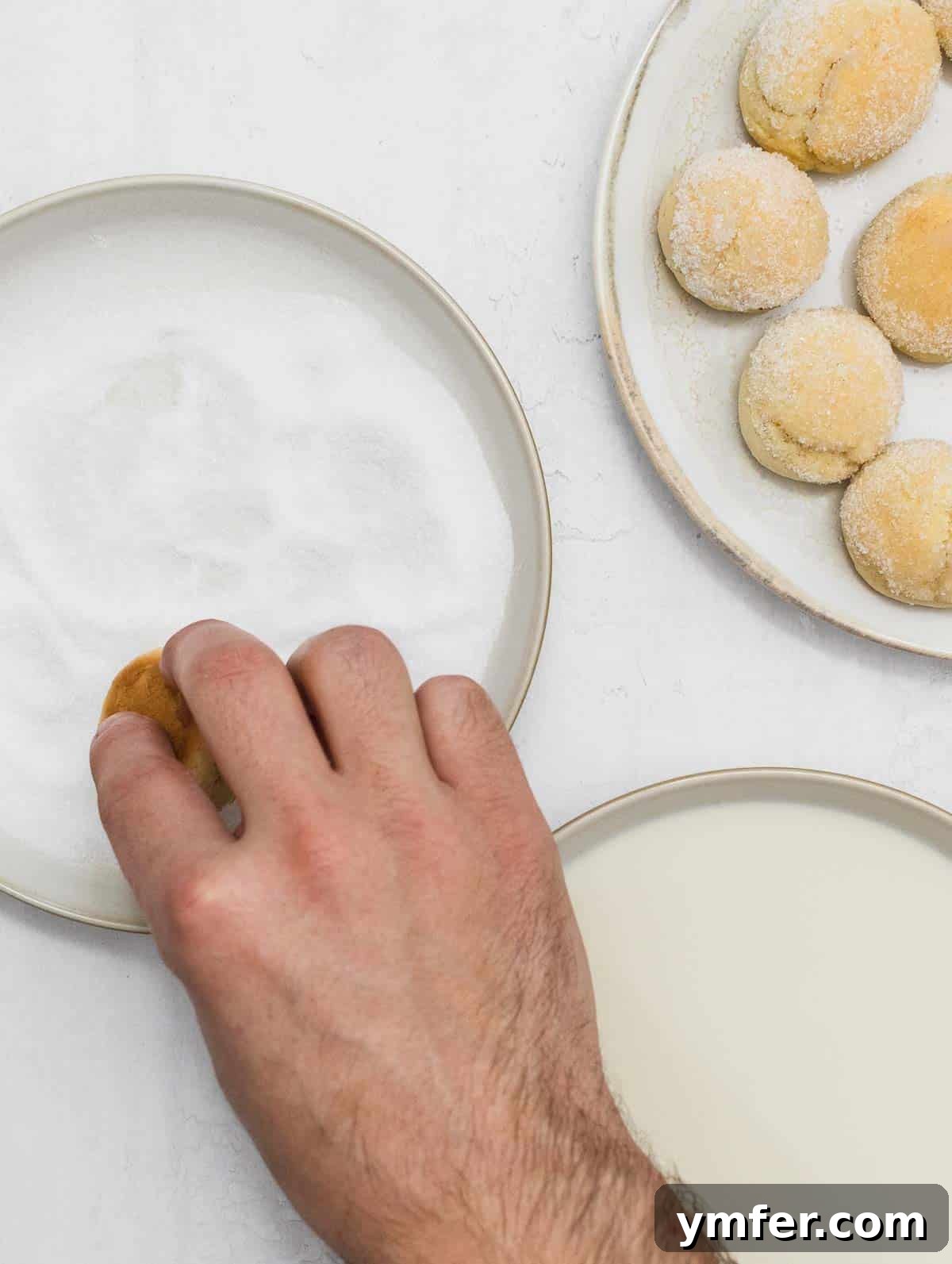 Castagnole Italian Carnival Fritters 16 Rolling the moist Castagnola in granulated sugar for a delightful sweet outer layer
