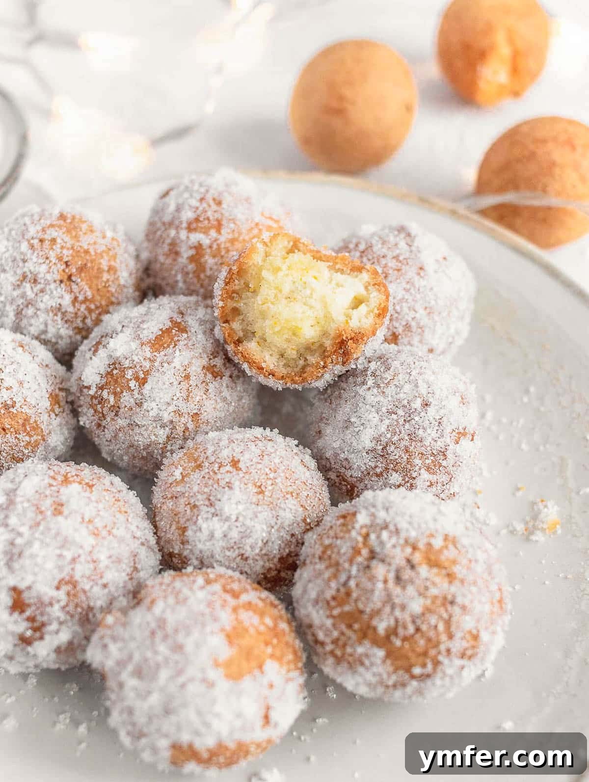 Castagnole Italian Carnival Fritters 21 A selection of sweet dough balls, both deep-fried and oven-baked Castagnole, displayed enticingly