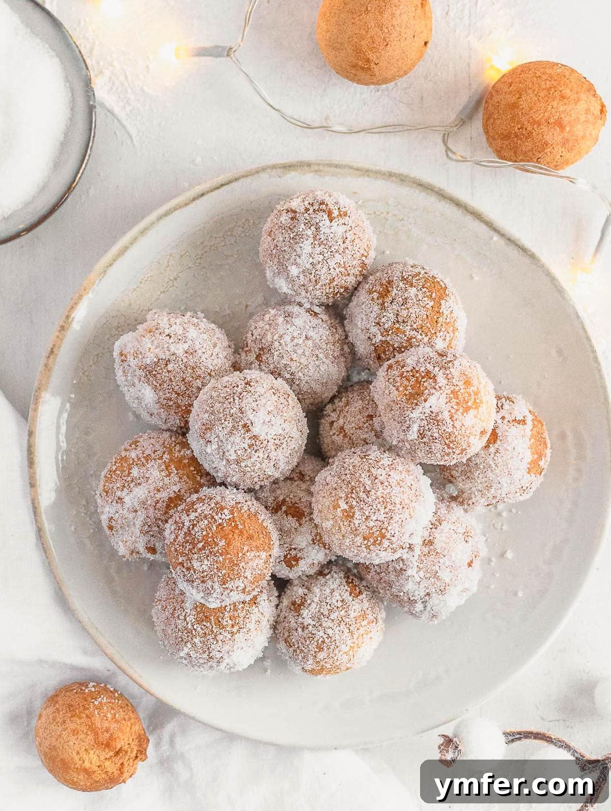 Castagnole Italian Carnival Fritters 6 Close-up of Castagnole or Italian doughnut holes, dusted with sugar, showing their perfectly round shape