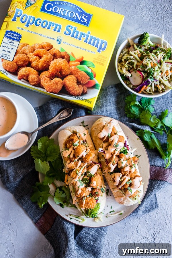 Fusion Shrimp Po Boy 3 Asian Shrimp Po Boy Sandwich on a plate with extra slaw on the side.