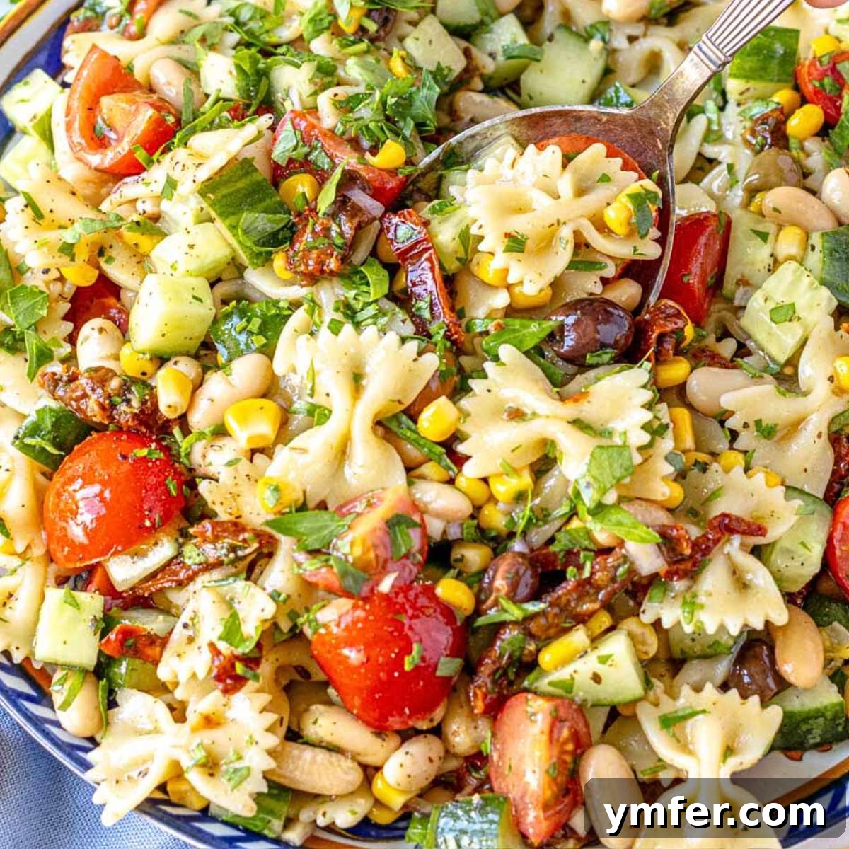 21 Fresh & Flavorful Summer Salads 4 Vegan pasta salad with cherry tomatoes, olives, and bell peppers.