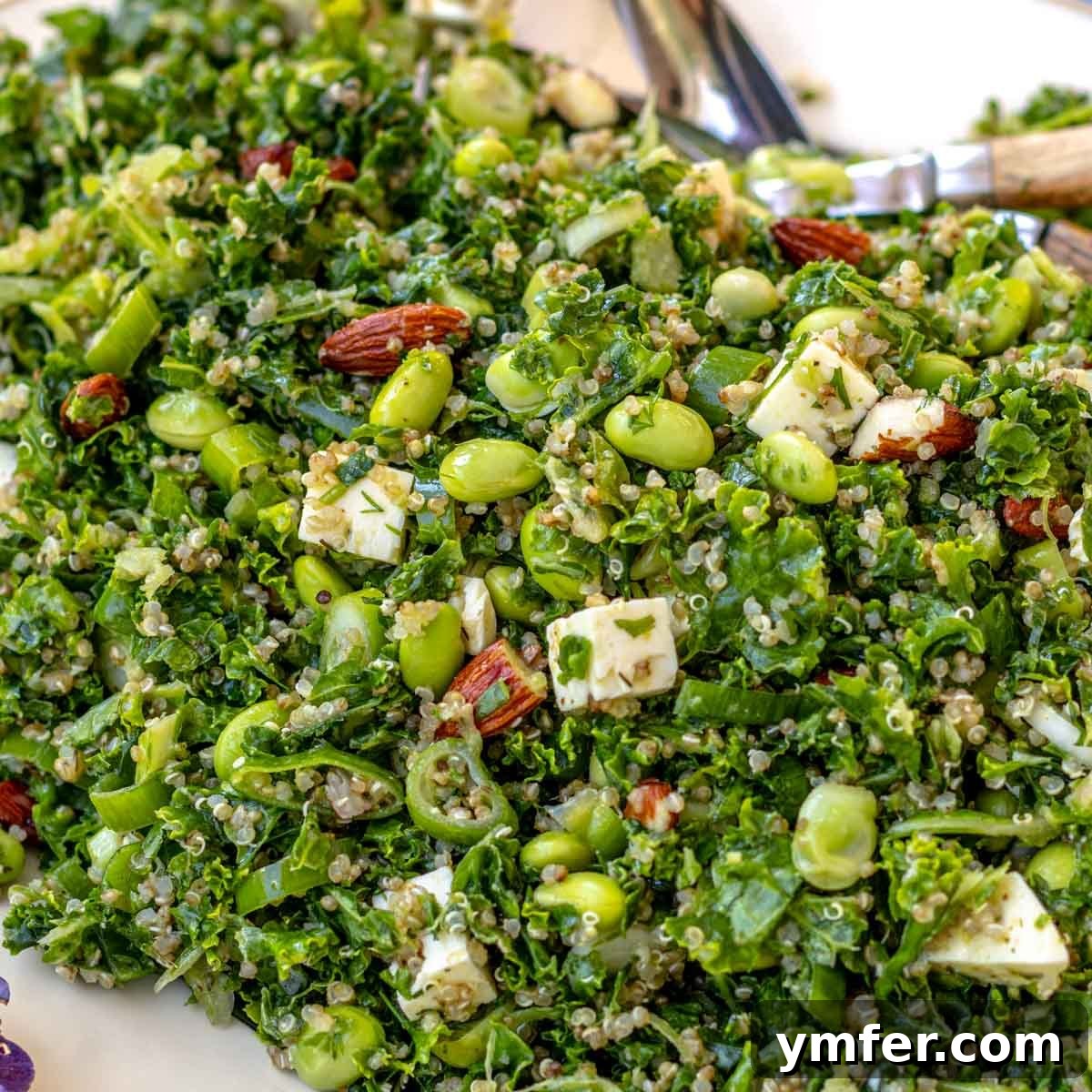 Beat the Heat 30 No-Bake Dinners 6 Nutritious kale quinoa salad with feta and almonds, packed with protein from edamame and quinoa, served chilled.