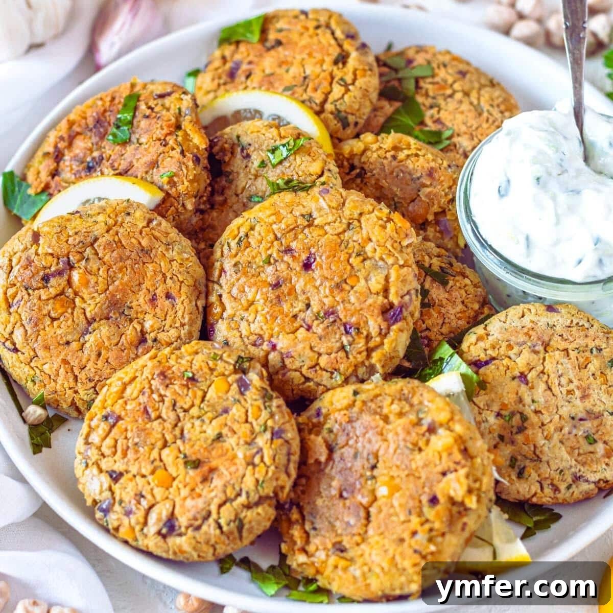 30 Delectable Picnic Recipes 17 Golden brown chickpea fritters arranged neatly on a plate.