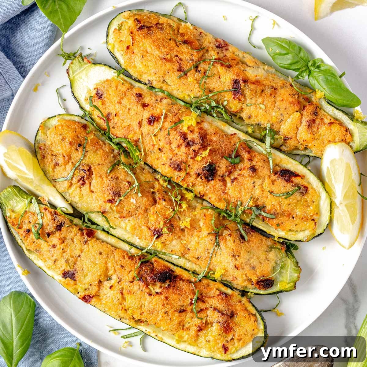 30 Delectable Picnic Recipes 19 Close-up of baked stuffed zucchini with creamy ricotta cheese.