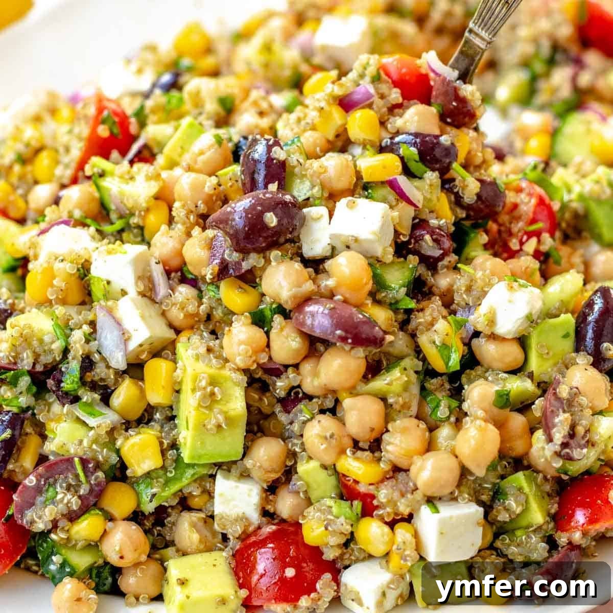 30 Delectable Picnic Recipes 5 A vibrant chickpea quinoa salad recipe, rich in color and nutrients.