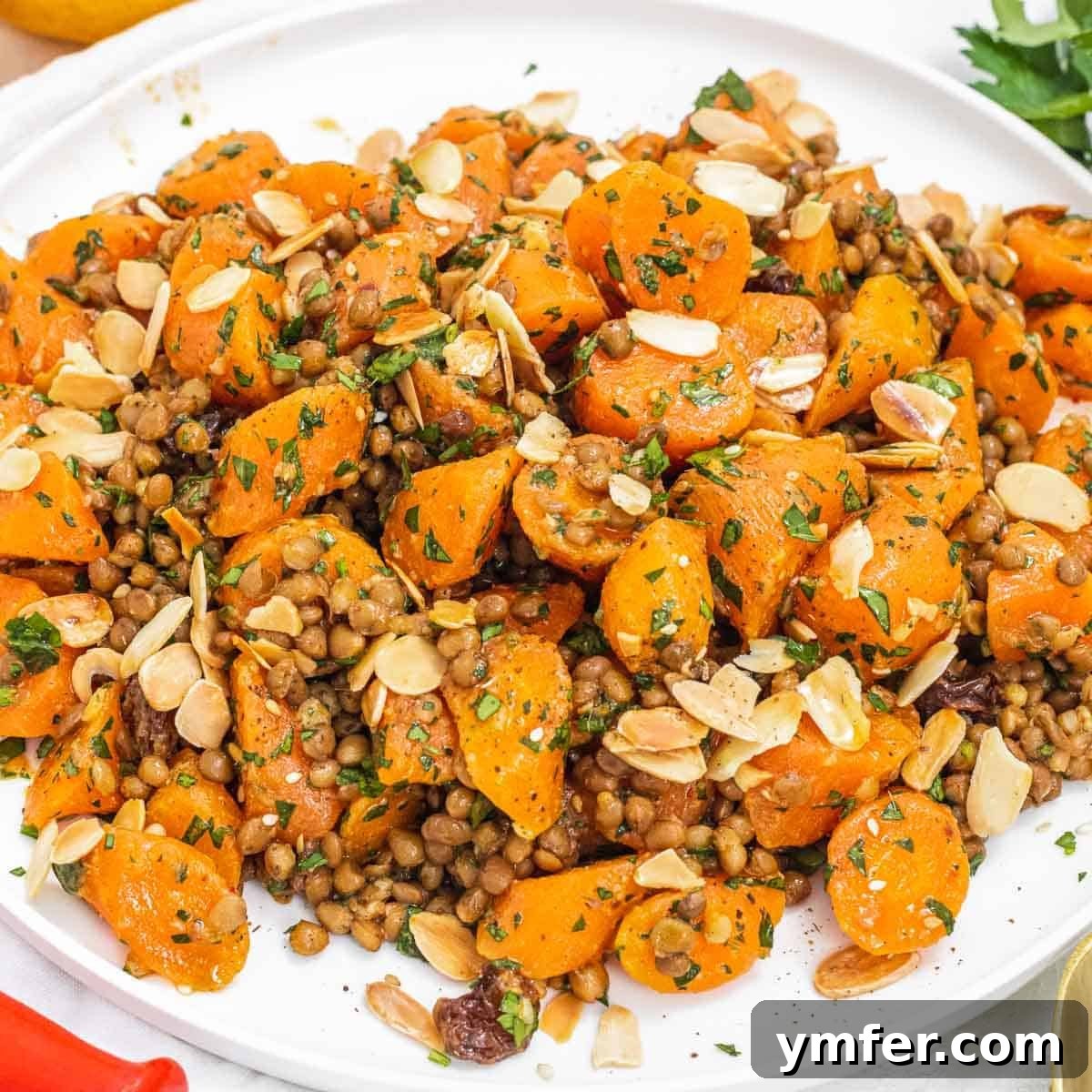 30 Delectable Picnic Recipes 6 Delicious lentil carrot salad topped with shaved almonds, perfect for a healthy meal.
