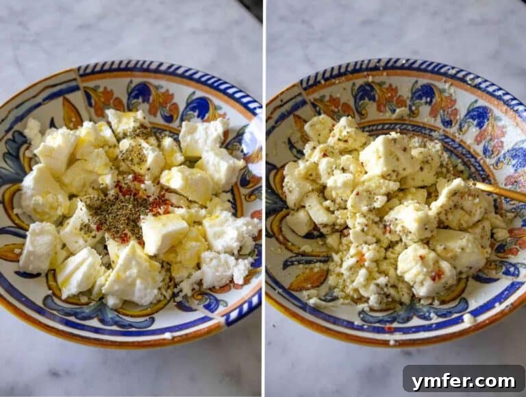 Creamy Butter Beans 10 Chunks of feta marinated with olive oil, oregano, honey, and red pepper flakes in a bowl.