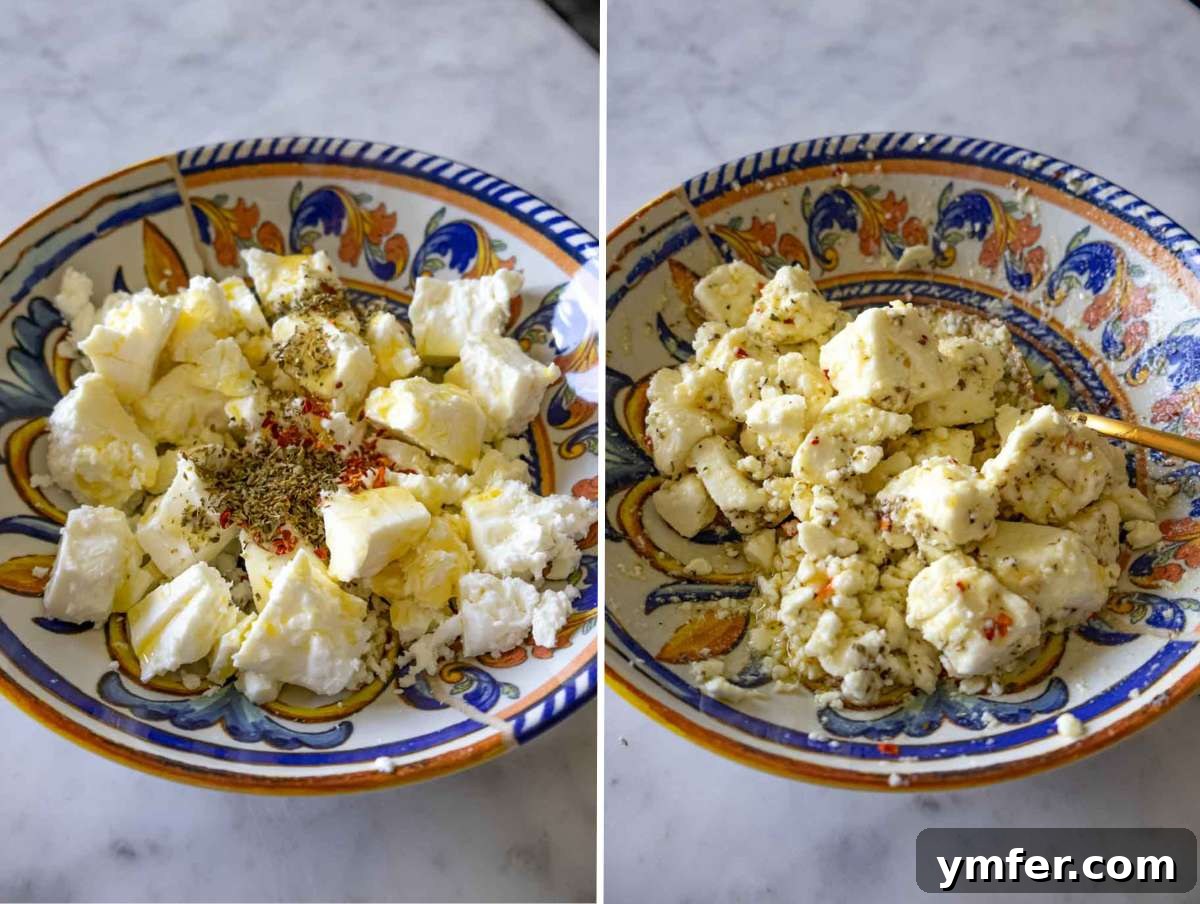 Creamy Butter Beans 5 Chunks of feta marinated with olive oil, oregano, honey, and red pepper flakes in a bowl.