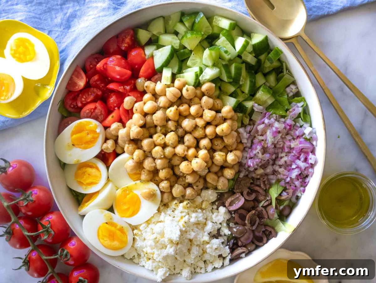 Vibrant Mediterranean Bowl 7 Step 5 and 6 - A large mixing bowl filled with all the colorful components of the Mediterranean chopped salad, ready to be tossed and served.