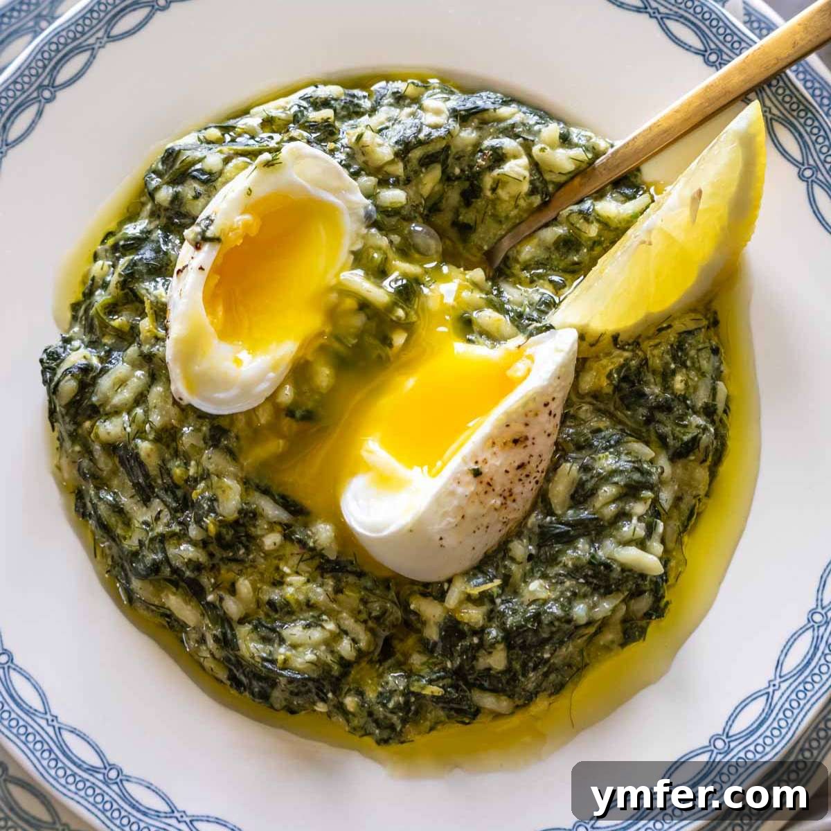 9 Mediterranean Proteins to Power Your Plate 23 Spanakorizo, a healthy Greek spinach and rice dish, presented in a white bowl with a perfectly poached egg on top.