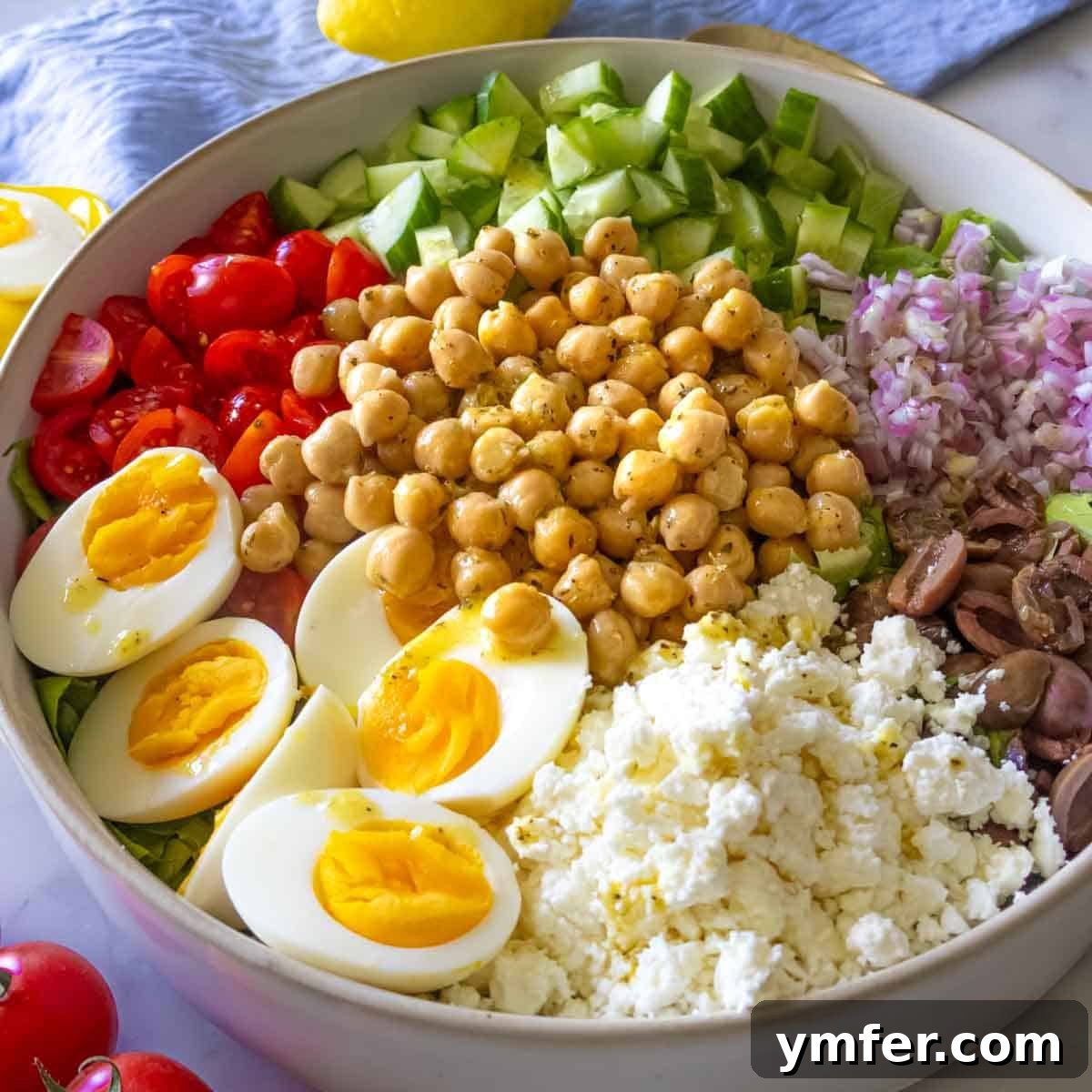 Strong & Satisfying: 21 High-Protein Salad Recipes 12 Mediterranean chopped salad in a bowl with feta.
