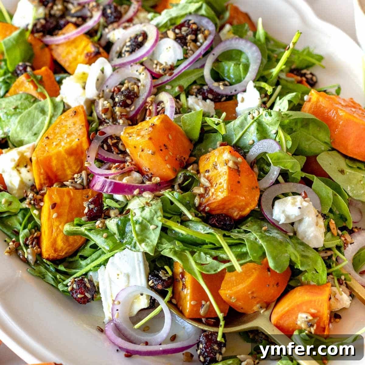 Strong & Satisfying: 21 High-Protein Salad Recipes 15 sweet potato salad with arugula and feta on a platter