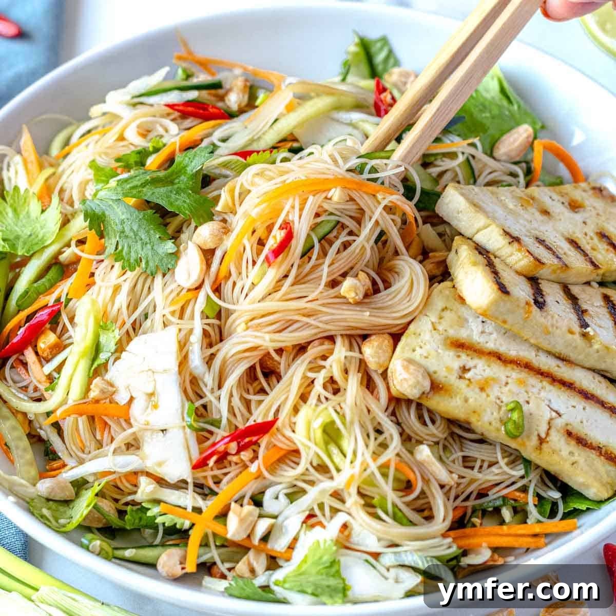 Strong & Satisfying: 21 High-Protein Salad Recipes 18 Asian noodle salad with grilled tofu in a white bowl