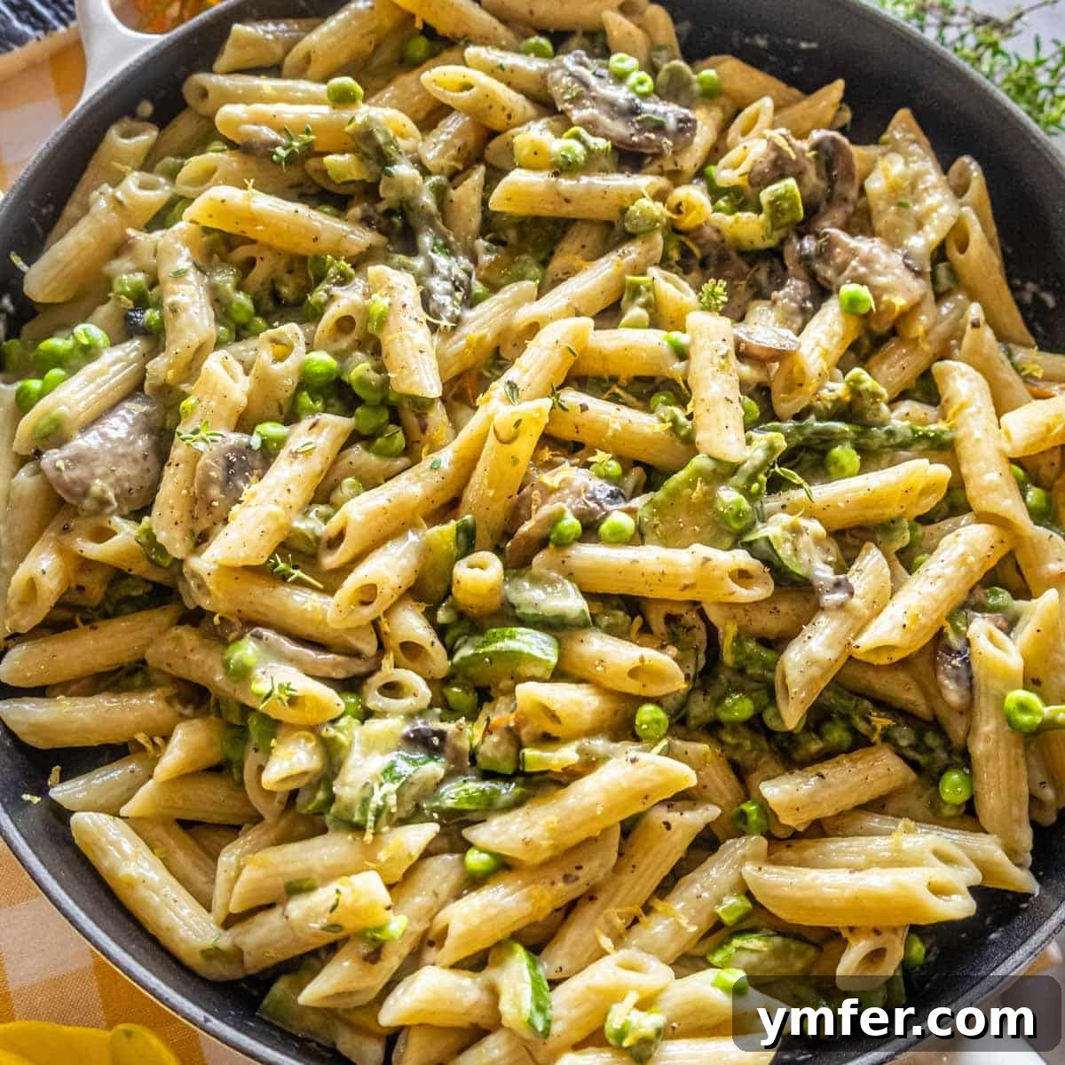 19 Brilliant Greek Yogurt Recipes for Lunch Dinner and Dessert 17 Creamy pasta primavera with fresh vegetables, featuring a Greek yogurt-based sauce.