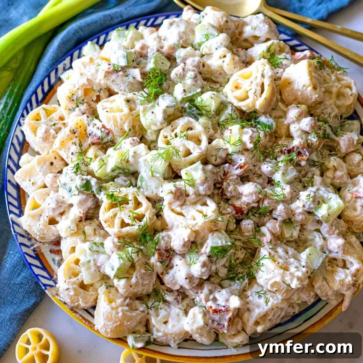 19 Brilliant Greek Yogurt Recipes for Lunch Dinner and Dessert 19 Colorful cold pasta salad with chickpeas and creamy yogurt dressing, perfect for a healthy summer meal featuring Greek yogurt.