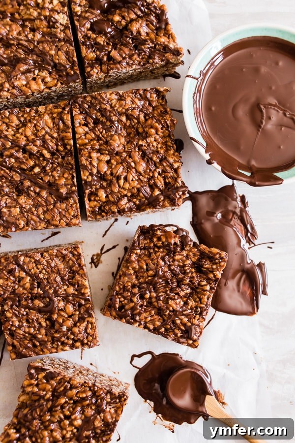 Nutella Peanut Butter Krispie Dream Bars 4 Peanut Butter Nutella Rice Krispie Treats drizzled with chocolate.