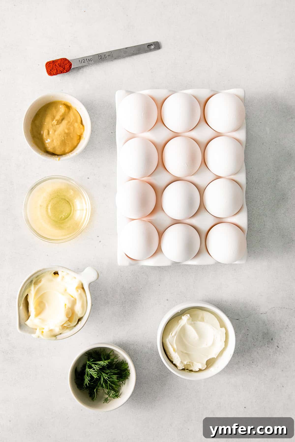 Heirloom Deviled Eggs 3 A selection of fresh ingredients laid out on a table, ready to be combined for Classic Deviled Eggs.