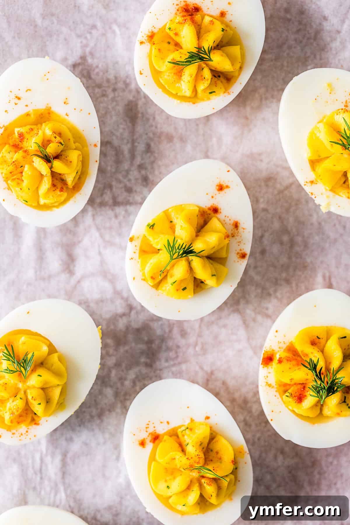 Heirloom Deviled Eggs 6 Close-up of Classic Deviled Eggs, beautifully garnished with paprika and fresh dill sprigs.
