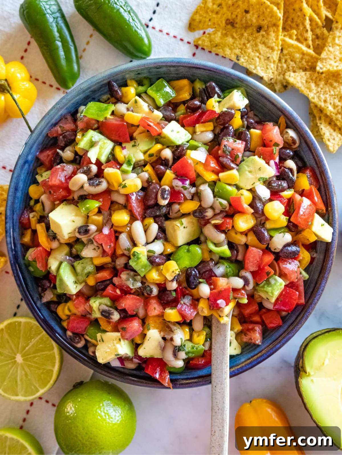 Southwestern Marinated Bean Medley 2 Top down view of Cowboy Caviar salad served with tortilla chips.