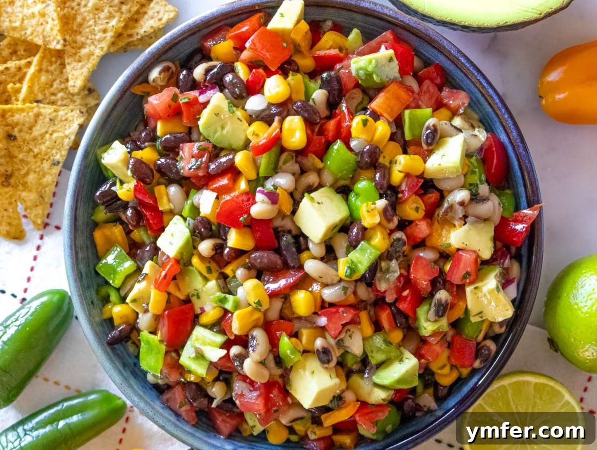 Southwestern Marinated Bean Medley 8 Step 4 Serving Cowboy Caviar dip with tortilla chips as a fresh colorful appetizer.