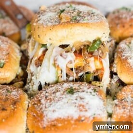 These baked supreme pizza sliders are the new baked sandwiches of your dreams. They taste just like loaded supreme pizza made with marinara sauce, spicy Italian sausage, pepperoni, mushrooms, green peppers, onions and lots of mozzarella cheese. You'll love how easy these baked sliders are to make!