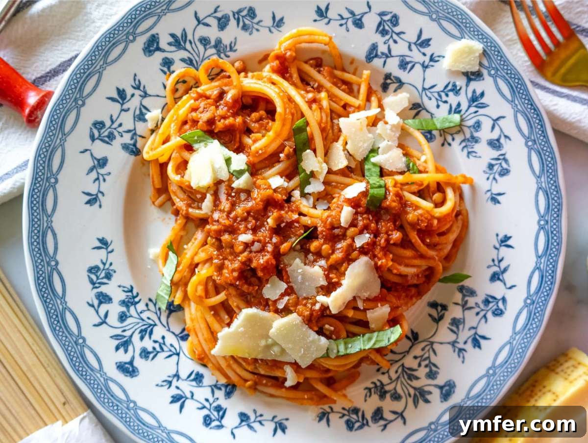 Speedy Lentil Bolognese Dinner in Half an Hour 8 Step 4: Easy lentil bolognese served with spaghetti and topped generously with fresh parsley.